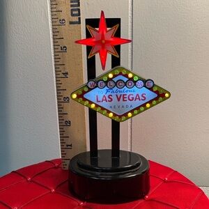 Miniature replica of the iconic "Welcome to Fabulous Las Vegas" sign.